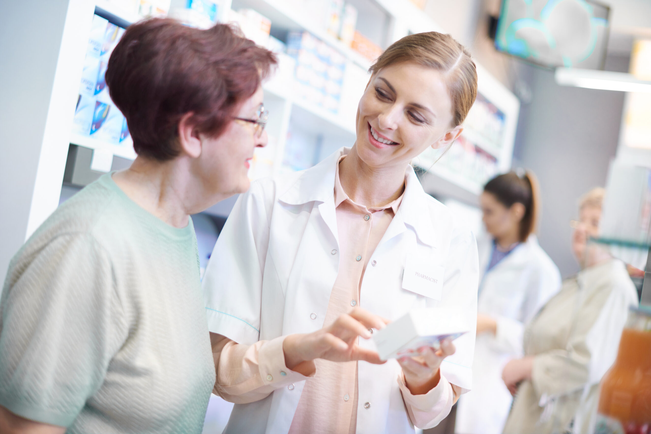 Senior woman doing shopping in pharmacy